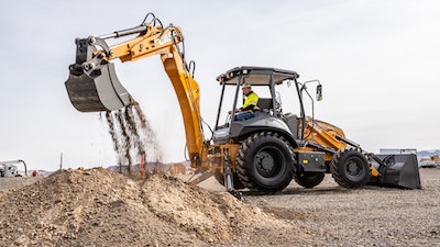 Case Utility Plus Backhoe dumping dirt on pile with back end boom