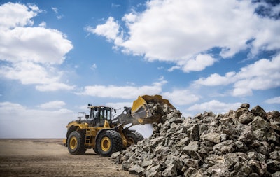 John Deere 844 P-Tier-Wheel Loader dumping rocks