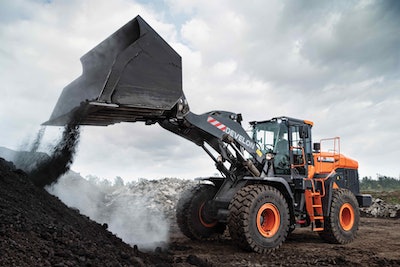 Develon 320 wheel loader dumping dirt