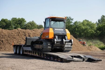 First-Doosan-Dozer-Delivery-1-scaled.jpg - Machines Wiki