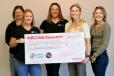 The 2023 Trailer for a Cause check presentation to Pockets of Hope Team:  (L-R) are Jennifer Bruzek, Briana Sjodin and Lisa Schroers, all of Pockets of Hope, and Brenda Jennissen and Bonnie Radjenovich, Felling Trailers’ owners.