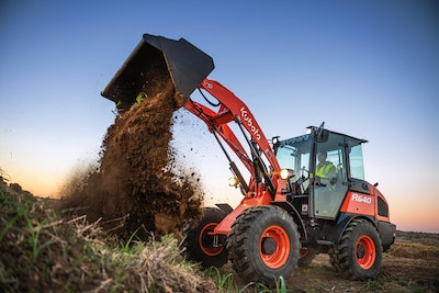 Kubota R640 compact wheel loader dumping dirt