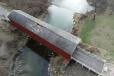 In the November incident, the semi driver attempted to drive through the north side of the 11-ft.-10-in.-tall bridge, damaging sections of the façade and roof.   (Photo courtesy of Illinois Department of Transportation)