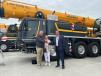 (L-R): Mike and Kathy Dawson of Big Red Crane Company Inc. join Craig Lane, Liebherr USA Co., at Customer Day.   (Photo courtesy of Liebherr)