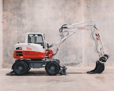 Takeuchi TB395W wheeled excavator studio shot from side