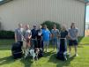 The Tough Seats team (L-R): Ted Gogolewski, warehouse manager; owner Nick Kemnitz; Tony Saucedo, head of assembly; Todd Kemnitz, warehouse; Neal Tarnowske, sales; Chris Baker, sales; Sarah Saucerman, office manager; Teddy Gogolewski, warehouse; and front and center is office mascot Gus Kemnitz.   (Photo courtesy of Tough Seats)