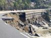 As a result of Hurricane Helene, the swollen river scoured the earth below the four-lane highway and washed away the eastbound lanes in several places.    (Photo courtesy of NCDOT)