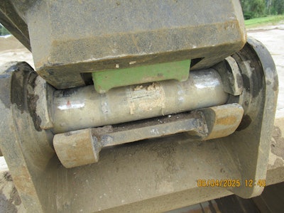 This photo showing the green safety latch on the quick coupler, which was missing from the excavator bucket that fell onto the worker, was taken the day after the incident when Rotschy brought in another excavator to continue work, according to L&I.
