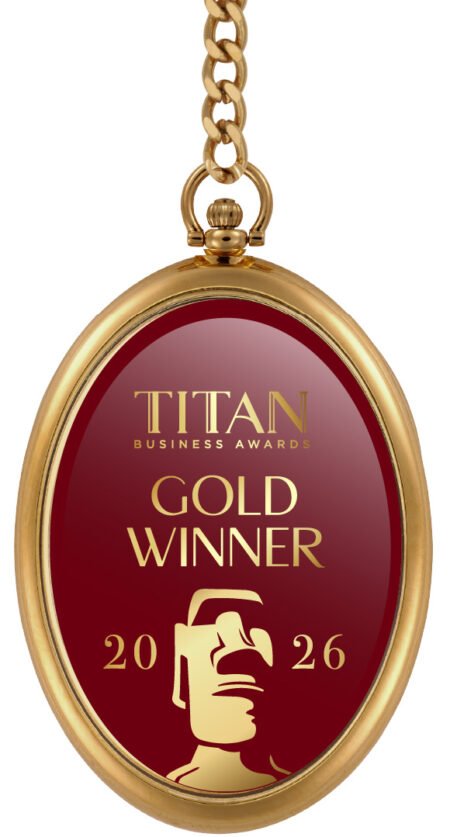 Gold Titan Business Awards pendant reading 'GOLD WINNER' for 2026, on a red background with a trophy icon and chain shows luxury.
