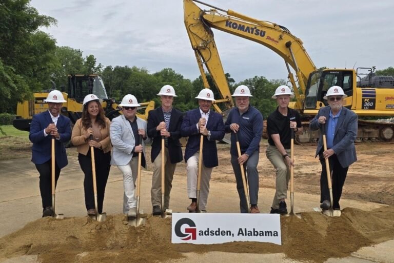 Robins & Morton Break Ground On $76.5M Athletic Center : CEG Groundbreaking ceremony in Gadsden, Alabama with eight officials in hard hats and shovels, construction site in background.