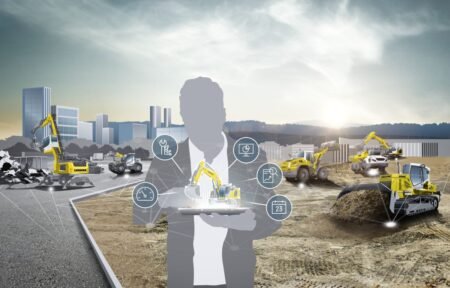 905x0_s3-71390-MNSW-LIEBHERR-MAINTENANCE-PEFORMANCE-1jpg - Machines Wiki Translucent silhouette of a person holding a holographic control panel with circular icons over a construction site filled with excavators and heavy machinery, suggesting project management and remote control.