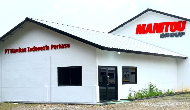 White industrial building with red 'MANITOU GROUP' sign on the roof and 'PT Manitou Indonesia Perkasa' lettering on the front wall
