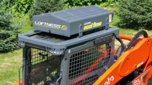 1783439096_63962_en_1f2e9_66114_loftness-svl110-kubota-cool-flowpng - Machines Wiki Loftness Cool Flow cooling unit mounted on top of an orange construction machine outdoors in a grassy area