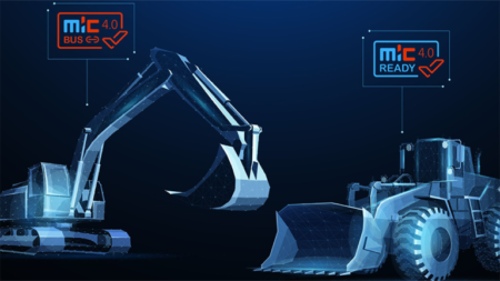 1784579181_64034_en_6e7d2_66206_mic-40-databasepng - Machines Wiki Futuristic illustration of a backhoe grabbing at a bulldozer, with glowing circuit lines symbolizing Industry 4.0 readiness and the logos MIC 4.0 Busy/Ready.