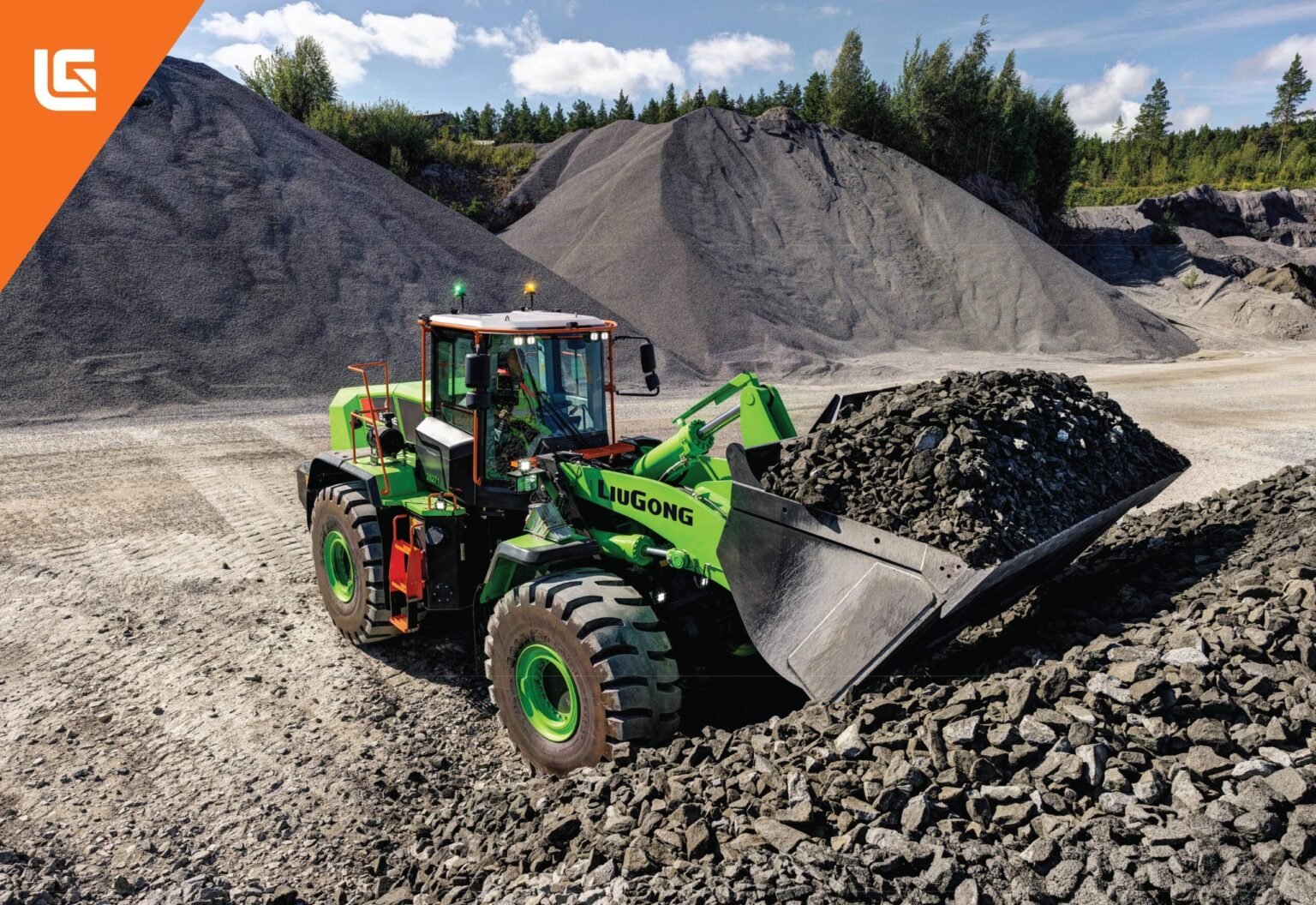 5188-AE2025_39-scaledjpg - Machines Wiki Green Liugong wheel loader at a gravel quarry beside large mounds of rock under a blue sky with trees in the background (orange corner banner).