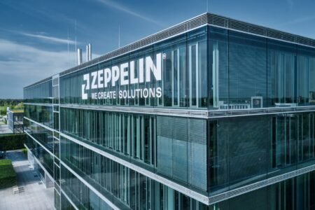 Zeppelin_Headquartersjpg - Machines Wiki Glass-fronted office building with large 'ZEPPELIN' logo and the slogan 'WE CREATE SOLUTIONS' on the facade