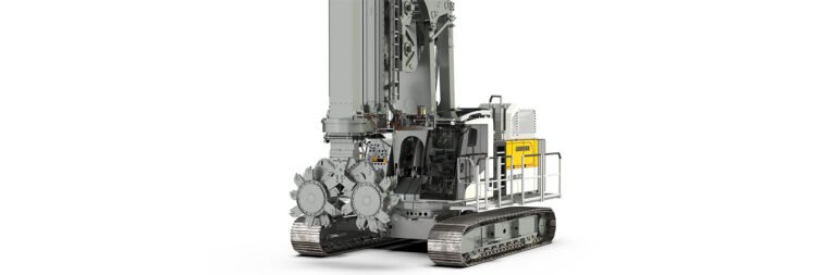 Crawler-mounted drilling rig with operator cab and yellow Liebherr branding, used for underground mining or large-scale drilling