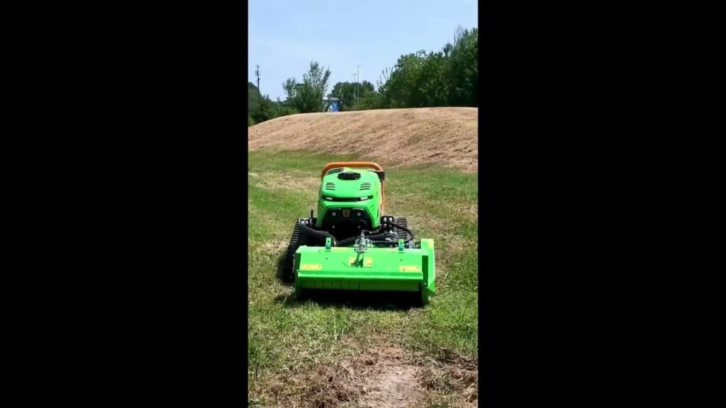 Demo Days 2026 by Rehlko Green riding lawn mower with a large front mower deck operating on a grassy field.
